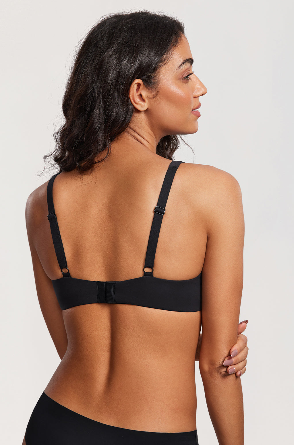 Back view of the Black bra - rows of hooks and eyes, strap sliders and a flat band