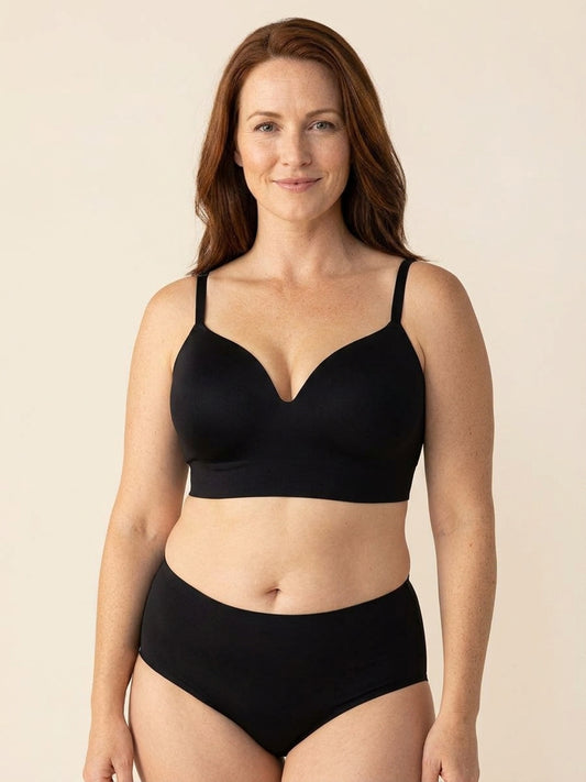 Snug wireless shaping bra in black, front view on a size 40G body