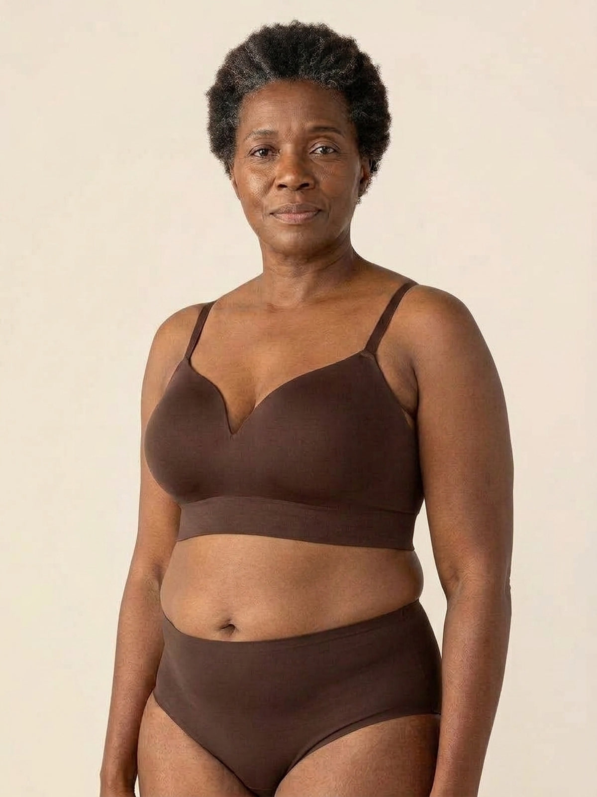 Snug wireless shaping bra in chocolate, front view on a size 44DDD body