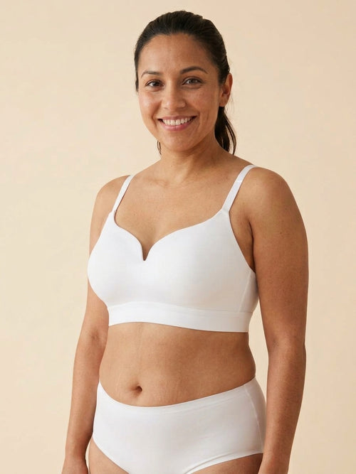 Snug wireless shaping bra in white, front view on a size 36C body