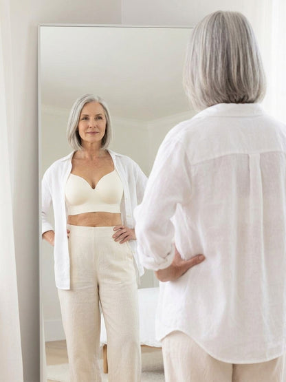 Chai bra under an open linen shirt, seen in a mirror