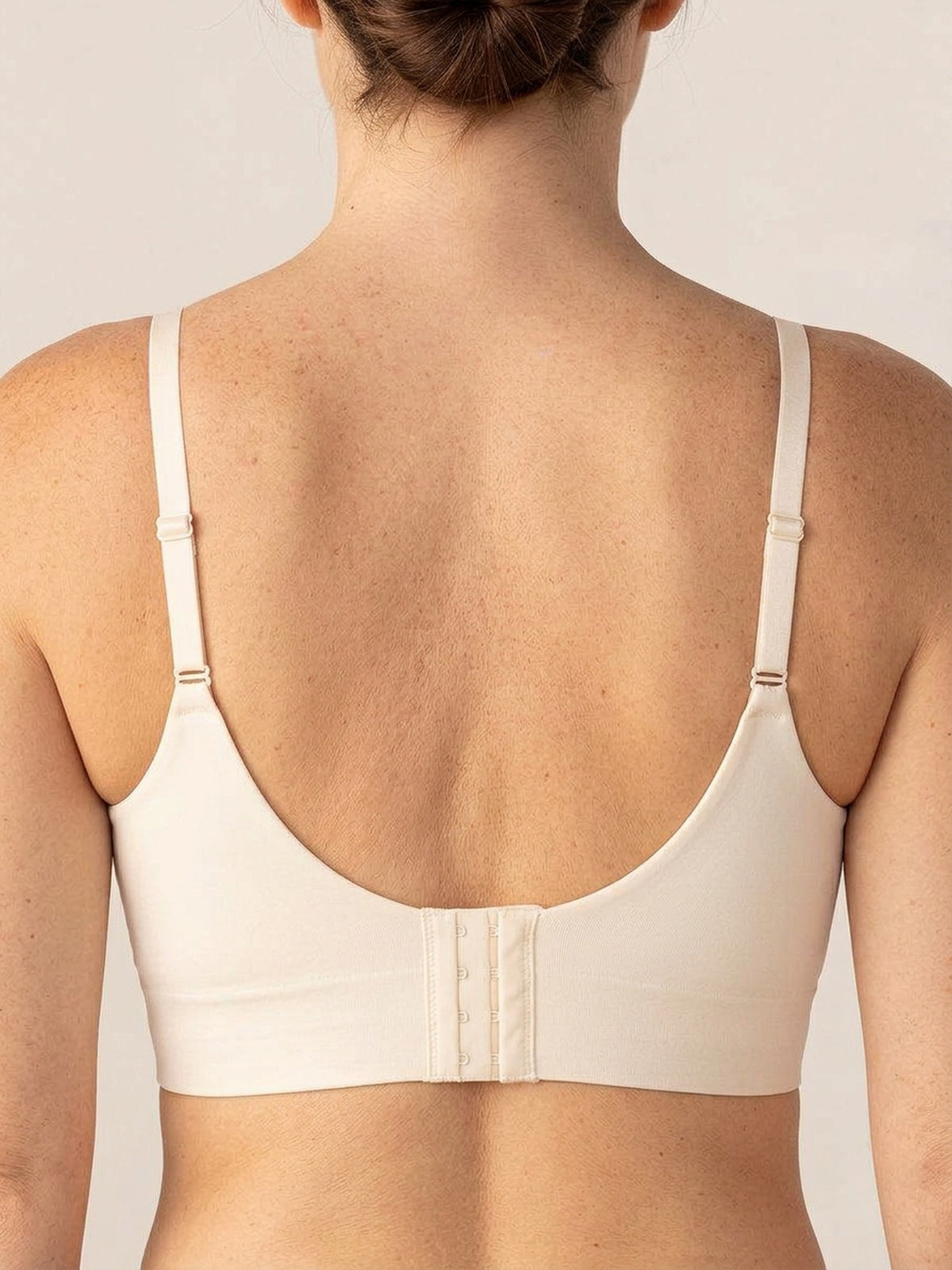 Close up of the four-row hook-and-eye closure at the center back