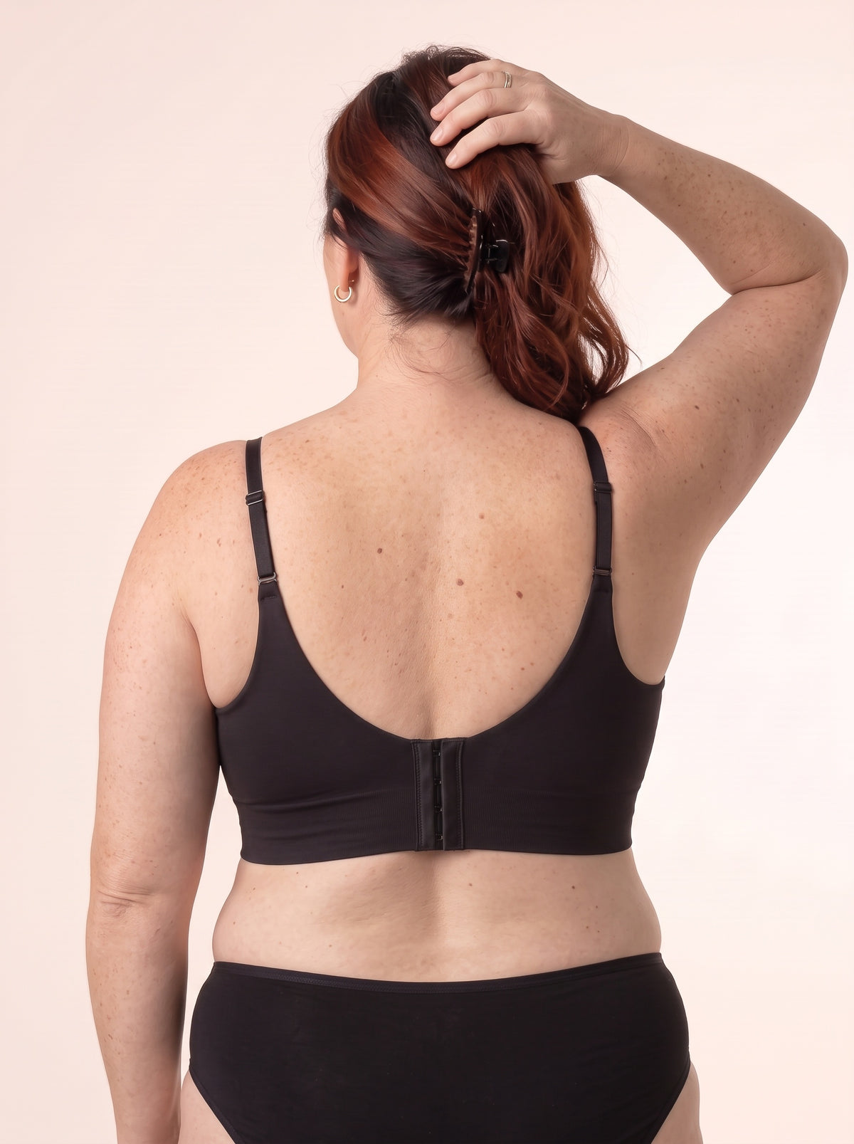 Melissa from the back in the Black bra — wide back band and centre hook-and-eye closure
