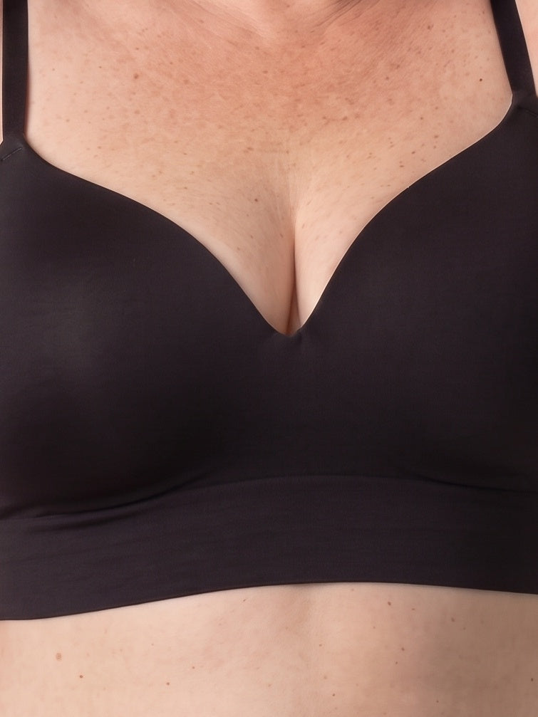 Close-up of the Black bra — molded cups, centre V and seamless band