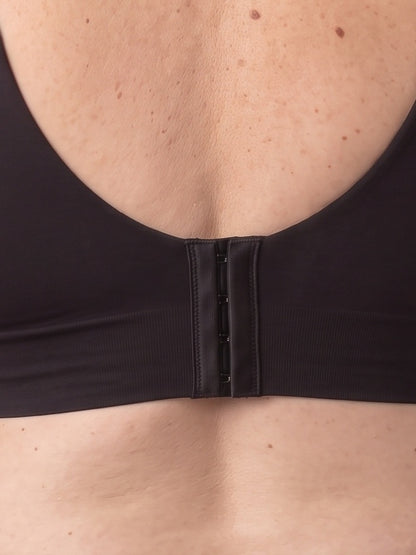 Close-up of the hook-and-eye closure at the centre back of the Black bra