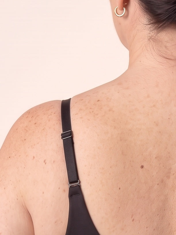 Close-up of the thin adjustable strap and slider on the Black bra